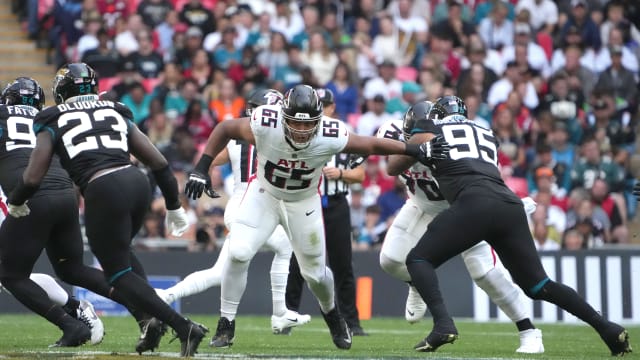 Oct 1, 2023; London, United Kingdom; Atlanta Falcons guard Matthew Bergeron (65) defends against Jacksonville Jaguars defensive end Roy Robertson-Harris (95) in the first half during an NFL International Series game at Wembley Stadium.